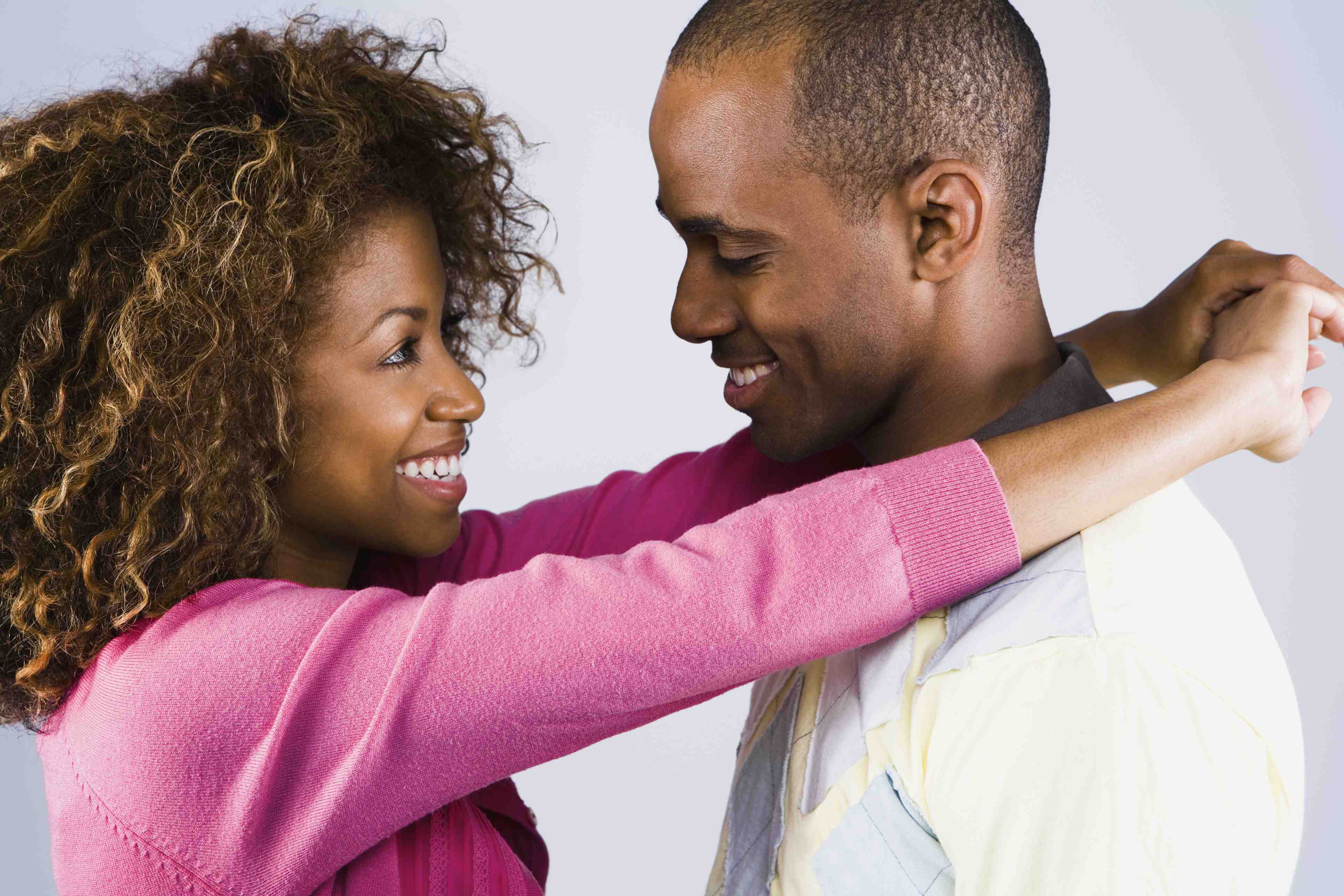 couple eye gazing smiling black african american hugging 80406036 – CROP